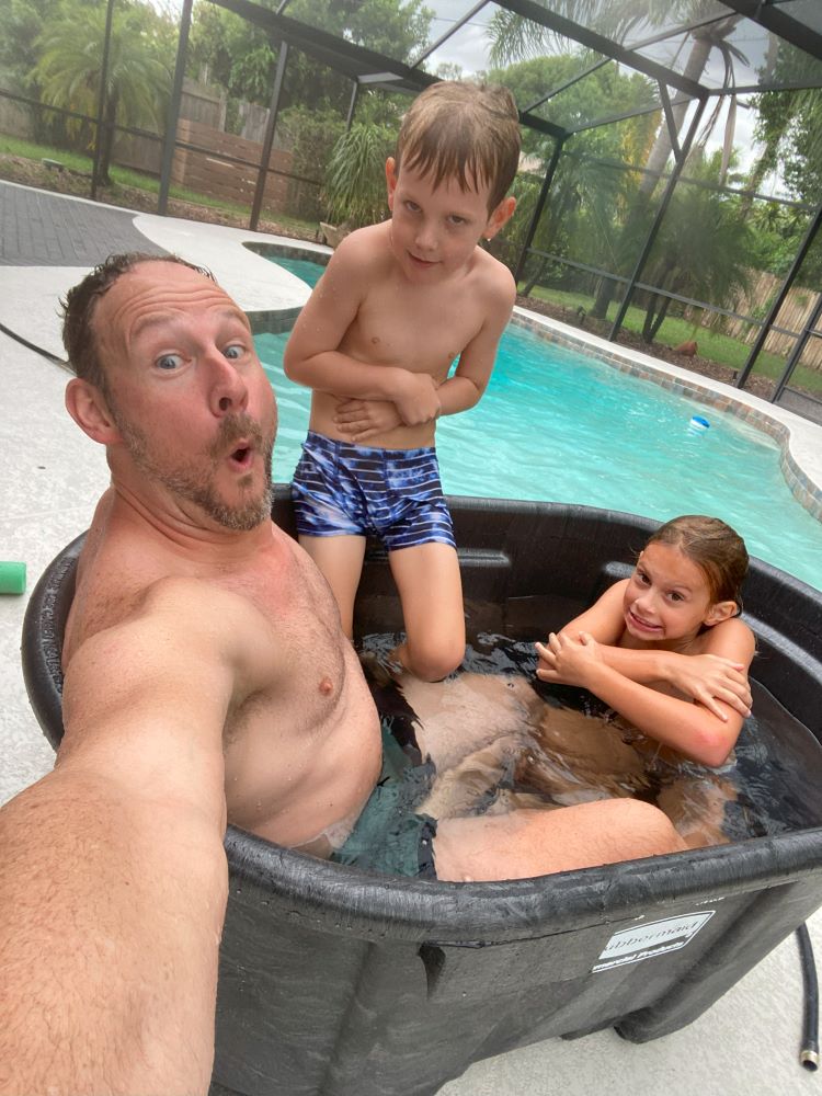 Kids in cold plunge with Dad