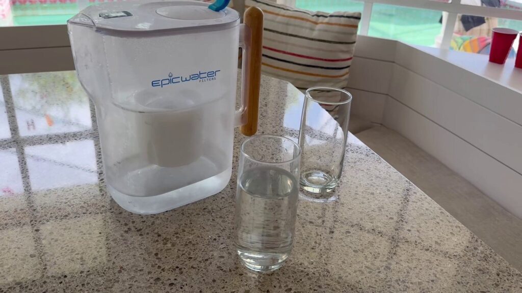 Epic Water Filters Pitcher review sitting on kitchen table with 2 glasses