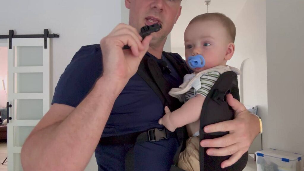 Wolf Tactical Mens Baby Carrier Review - holding baby in while buckling
