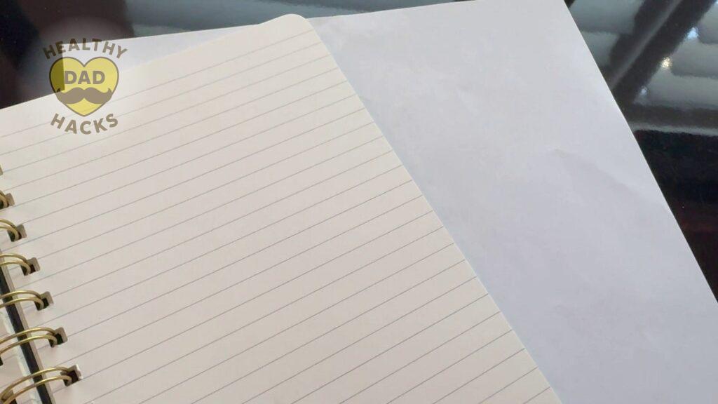 PAPERAGE small medium size notebook ivory colored pages compared to bright white paper