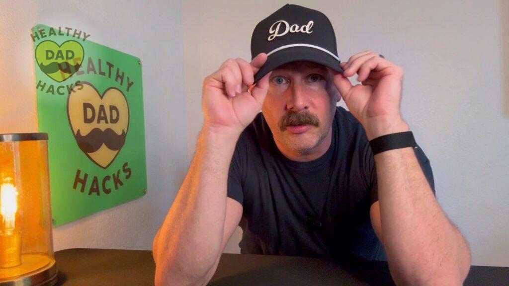 Dad adjusts Branded Bills brim during review