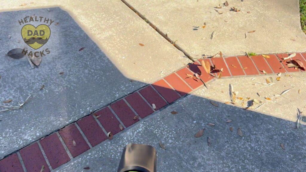 Yuquesen handheld cordless leaf blower using on driveway